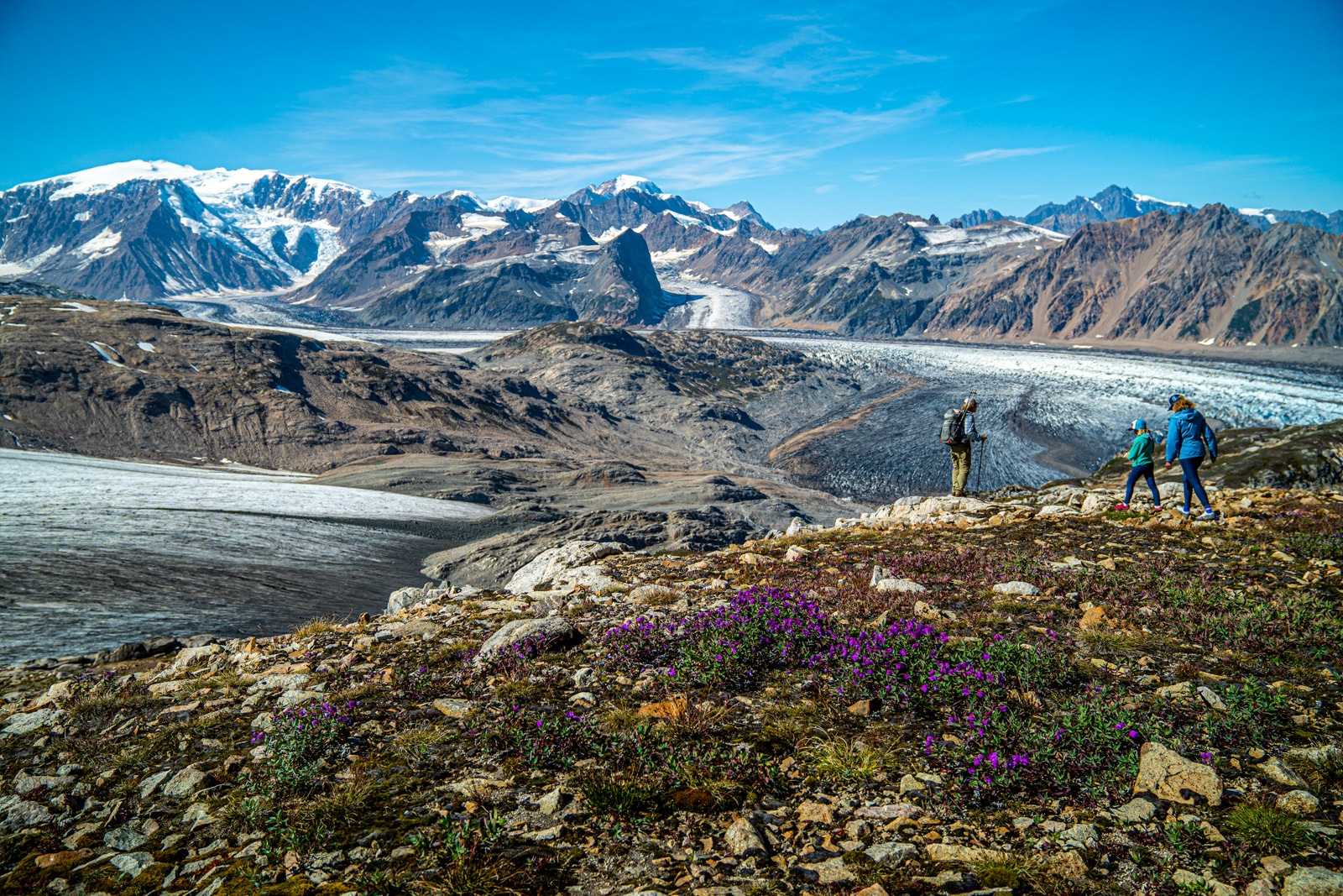 a family out for a hike over glaciers in the tordrillo mountains